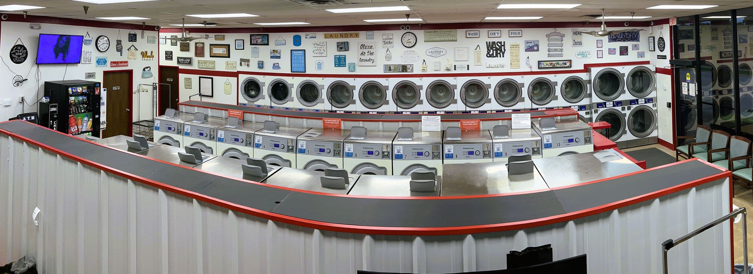 Panorama of the main floor, rows of washers and dryers